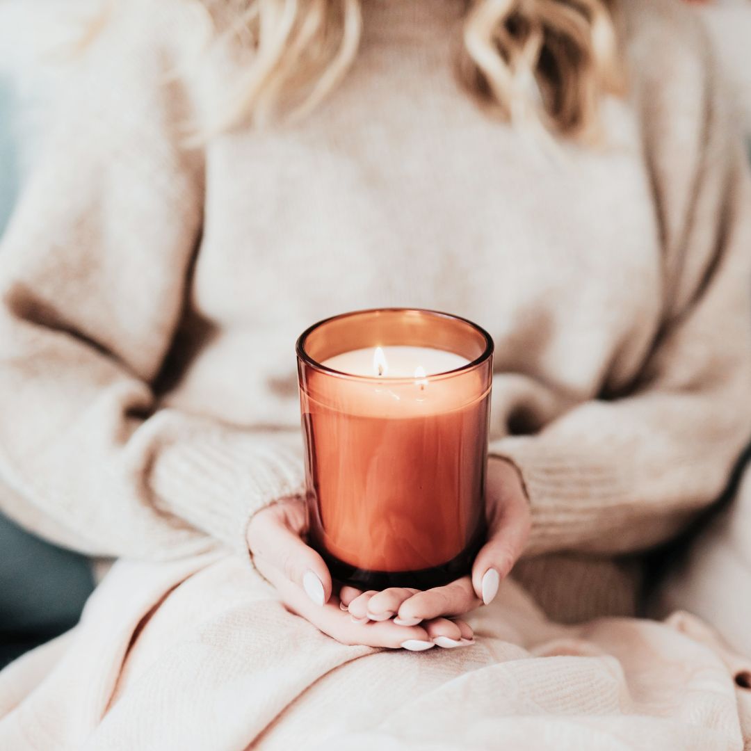 woman holding a candle